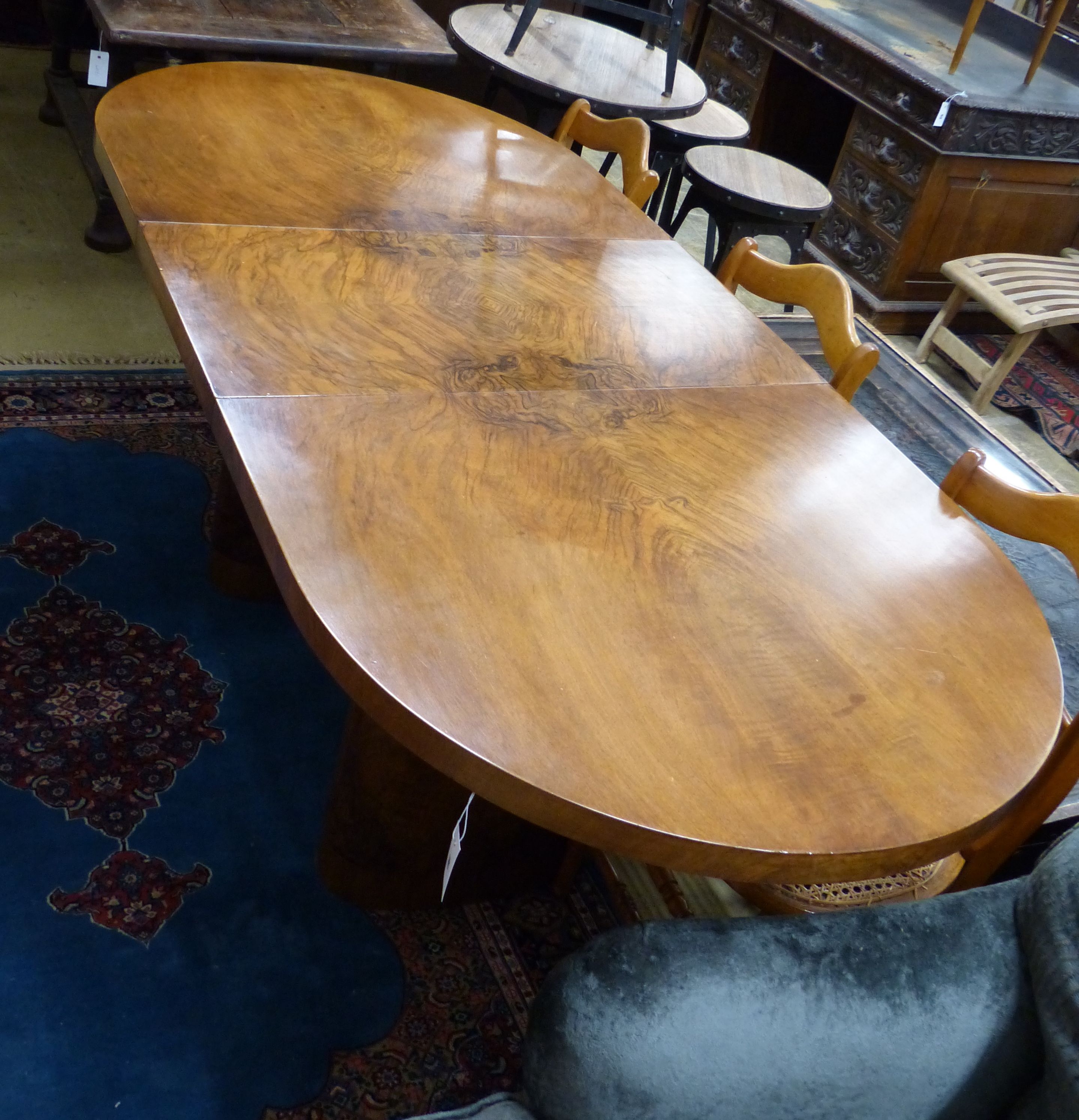 An Art Deco figured walnut extending dining table with one leaf, extends to 199cm, width 92cm